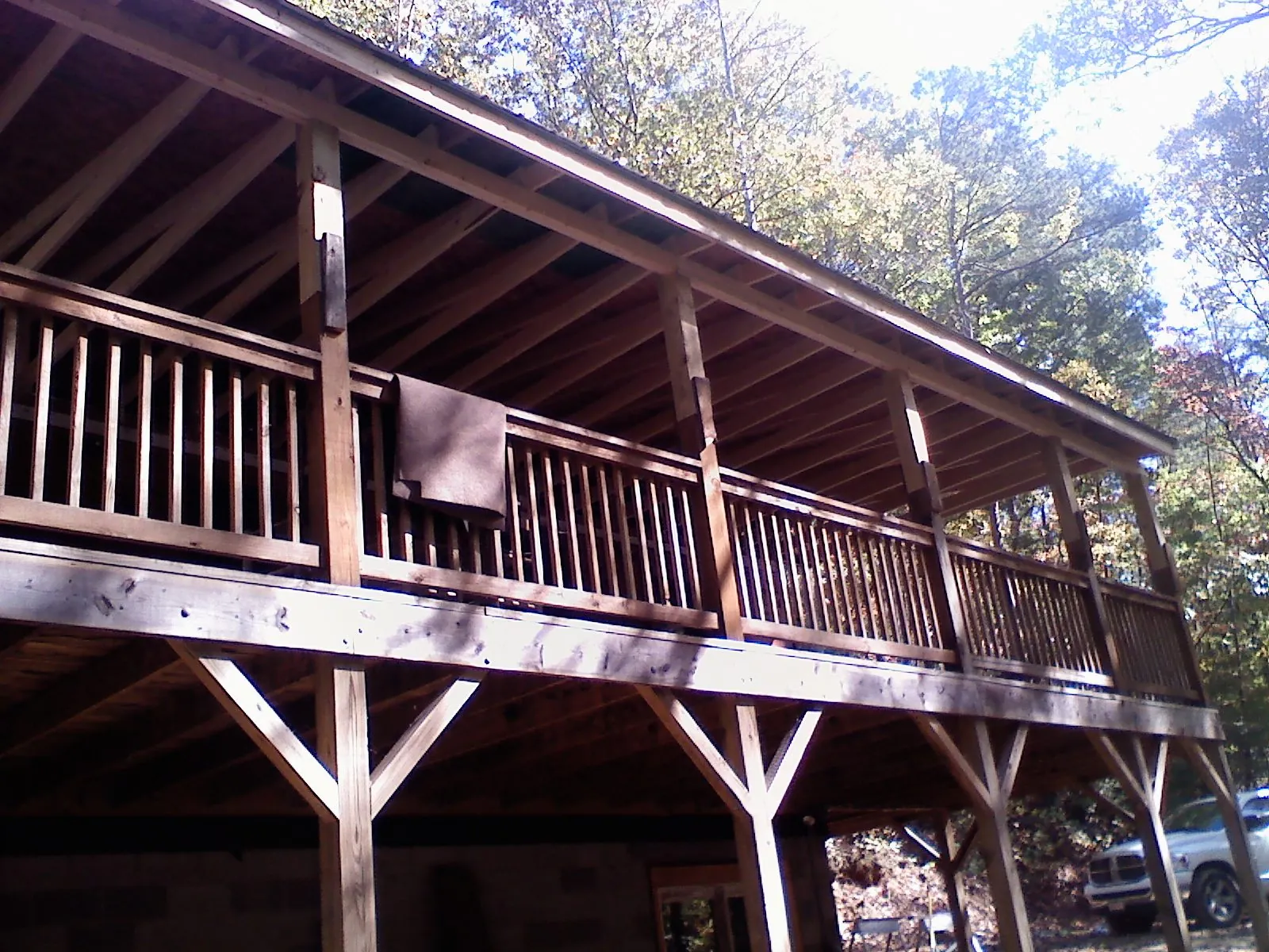 Timber framing under a new elevated porch and deck — Roof Leak Repair in Lemont Furnace by Roofing Brothers